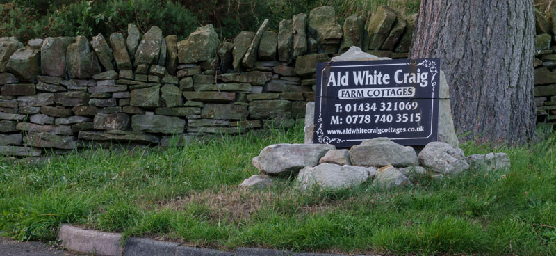 Ald White Craig Cottages roadside sign.